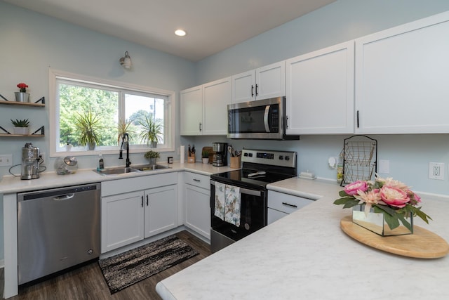 700 6th St E, Saint Paul, MN 55106 - kitchen with appliances with stainless steel finishes, light countertops, dark wood finished floors, and recessed lighting