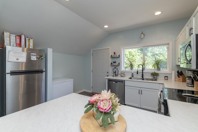 700 6th St E, Saint Paul, MN 55106 - kitchen with stainless steel appliances, lofted ceiling, recessed lighting, light countertops, and open shelves