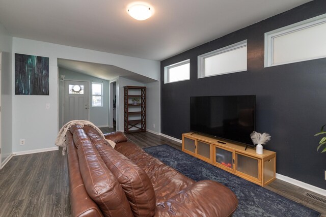700 6th St E, Saint Paul, MN 55106 - living area with wood finished floors, healthy amount of natural light, and vaulted ceiling