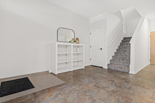 2566 Ellis Ave Unit 103, Saint Paul, MN 55114 - entrance foyer with stairs and stone finish floors