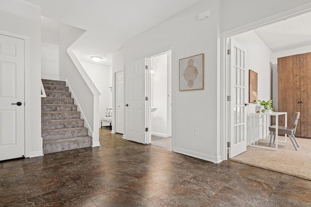 2566 Ellis Ave Unit 103, Saint Paul, MN 55114 - foyer featuring stairs and stone tile flooring