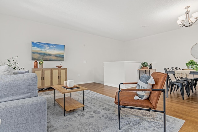 2566 Ellis Ave Unit 103, Saint Paul, MN 55114 - living area featuring a chandelier and wood finished floors