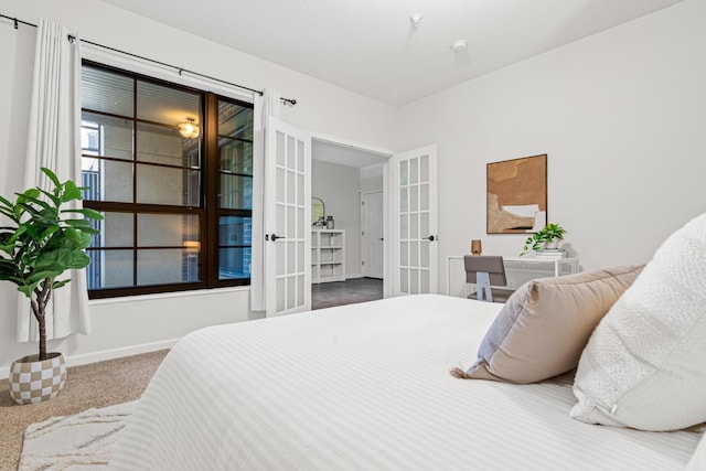 2566 Ellis Ave Unit 103, Saint Paul, MN 55114 - carpeted bedroom featuring french doors and baseboards