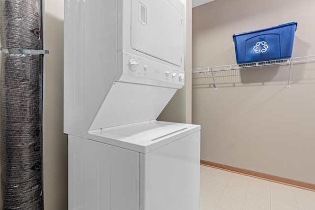 2566 Ellis Ave Unit 103, Saint Paul, MN 55114 - laundry room featuring estacked washer and dryer and baseboards