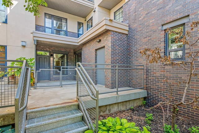 2566 Ellis Ave Unit 103, Saint Paul, MN 55114 - doorway to property featuring covered porch and brick siding