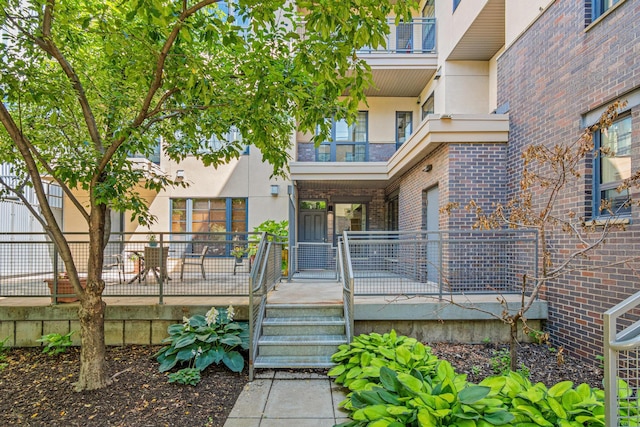 2566 Ellis Ave Unit 103, Saint Paul, MN 55114 - entrance to property featuring stucco siding, brick siding, and a porch
