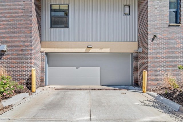 2566 Ellis Ave Unit 103, Saint Paul, MN 55114 - garage featuring concrete driveway