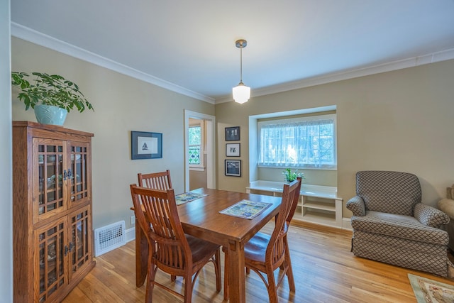 5229 42nd Ave S, Minneapolis, MN 55417 - dining area featuring light wood-style flooring and crown molding