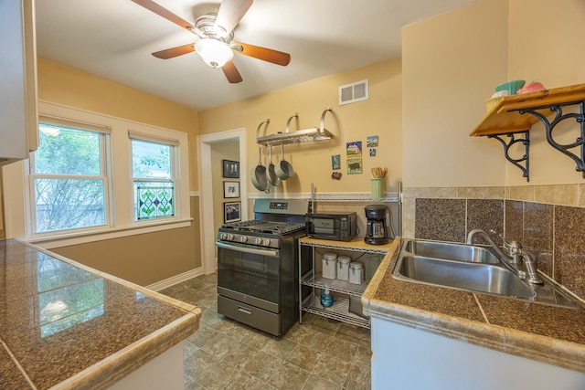 5229 42nd Ave S, Minneapolis, MN 55417 - kitchen featuring gas range, tile counters, ceiling fan, and open shelves