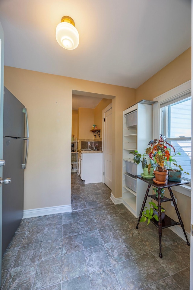 5229 42nd Ave S, Minneapolis, MN 55417 - corridor featuring baseboards and dark stone finish floors