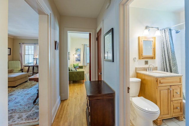 5229 42nd Ave S, Minneapolis, MN 55417 - bathroom with connected bathroom, wood finished floors, vanity, and curtained shower