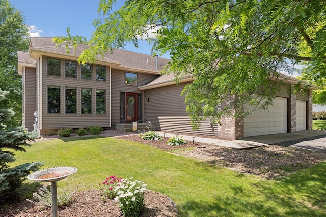 18675 86th Pl N, Maple Grove, MN 55311 - view of front facade with a front lawn, driveway, a shingled roof, and a garage