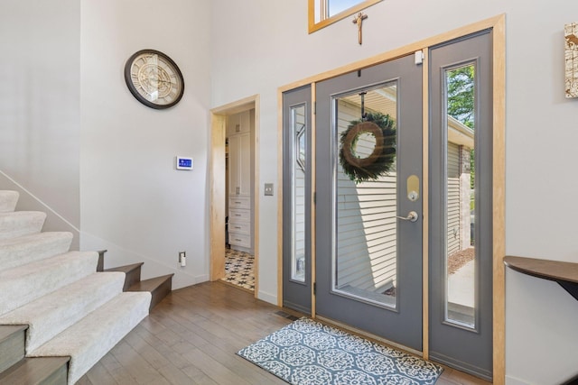18675 86th Pl N, Maple Grove, MN 55311 - entrance foyer featuring hardwood / wood-style flooring, healthy amount of natural light, and stairway