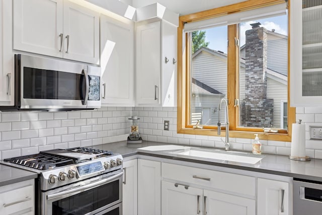 18675 86th Pl N, Maple Grove, MN 55311 - kitchen with stainless steel appliances, white cabinets, and backsplash