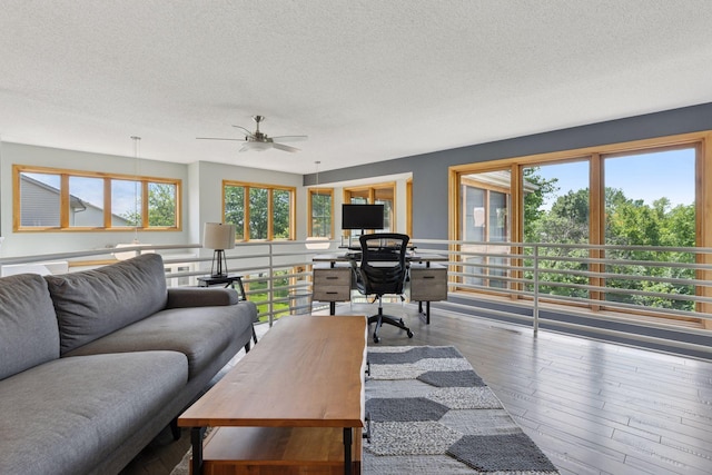18675 86th Pl N, Maple Grove, MN 55311 - living area featuring a textured ceiling, an office area, healthy amount of natural light, wood finished floors, and ceiling fan