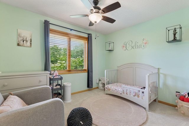 18675 86th Pl N, Maple Grove, MN 55311 - bedroom featuring carpet floors, a crib, a ceiling fan, and a textured ceiling