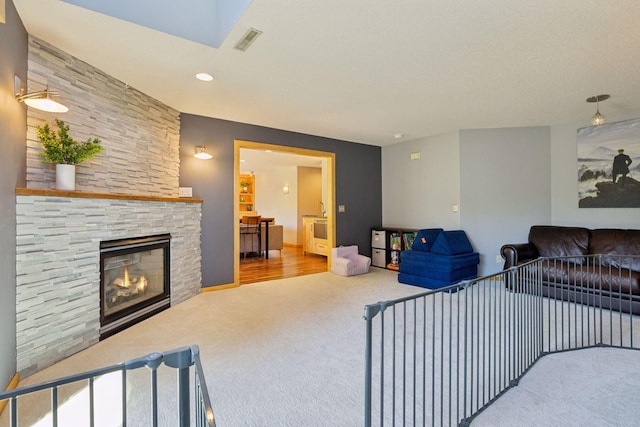 18675 86th Pl N, Maple Grove, MN 55311 - living area featuring carpet, a stone fireplace, and recessed lighting