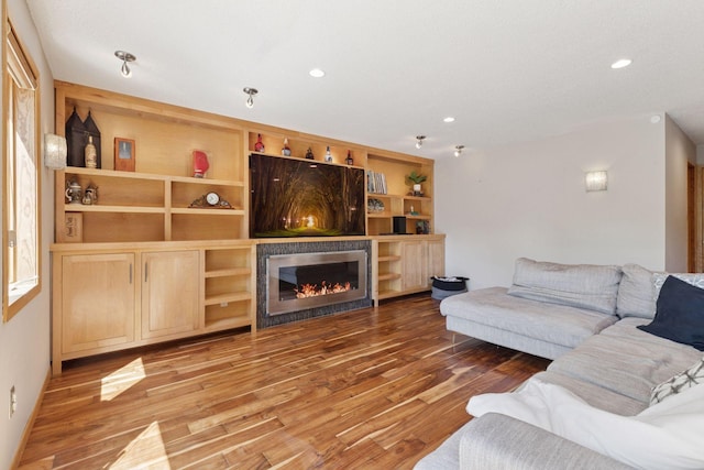 18675 86th Pl N, Maple Grove, MN 55311 - living room featuring wood finished floors, a glass covered fireplace, and recessed lighting