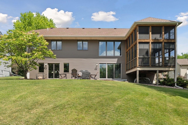 18675 86th Pl N, Maple Grove, MN 55311 - back of house featuring a yard, a shingled roof, and a sunroom