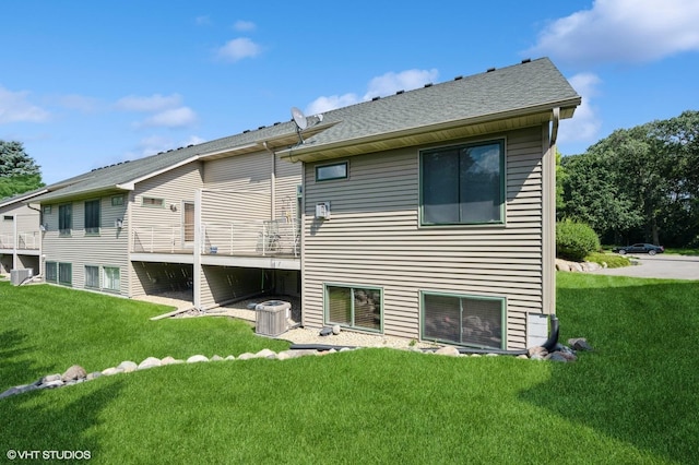4224 93rd Ave N, Brooklyn Park, MN 55443 - rear view of property featuring a lawn and roof with shingles