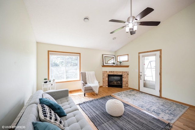4224 93rd Ave N, Brooklyn Park, MN 55443 - living area featuring wood finished floors, a brick fireplace, a ceiling fan, and high vaulted ceiling