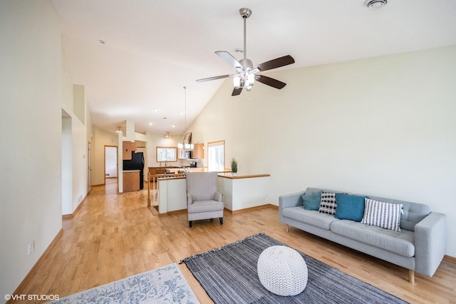 4224 93rd Ave N, Brooklyn Park, MN 55443 - living room with light wood-style flooring, a ceiling fan, and high vaulted ceiling