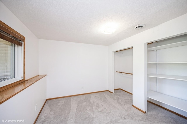 4224 93rd Ave N, Brooklyn Park, MN 55443 - unfurnished bedroom with carpet flooring and a textured ceiling