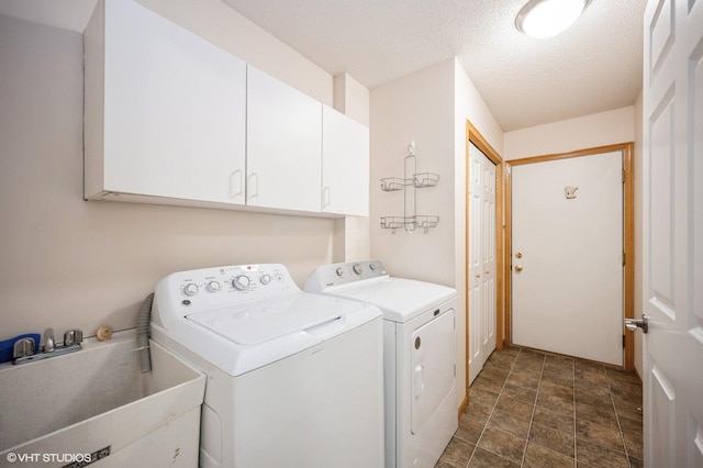 4224 93rd Ave N, Brooklyn Park, MN 55443 - washroom with cabinet space, separate washer and dryer, stone finish flooring, and a textured ceiling