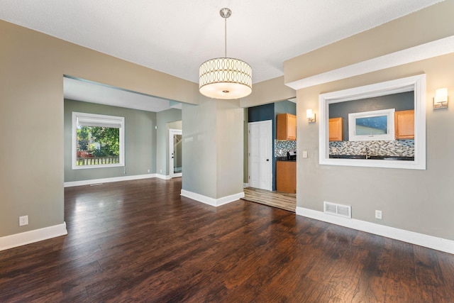 3204 5th Ave S, Minneapolis, MN 55408 - spare room with wood finished floors and baseboards
