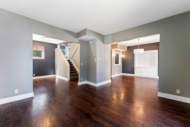 3204 5th Ave S, Minneapolis, MN 55408 - empty room featuring wood finished floors and stairway