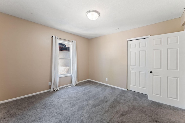 3204 5th Ave S, Minneapolis, MN 55408 - unfurnished bedroom featuring carpet floors and a closet