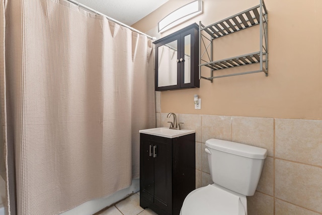 3204 5th Ave S, Minneapolis, MN 55408 - full bath featuring tile walls, vanity, shower / tub combo, and tile patterned flooring