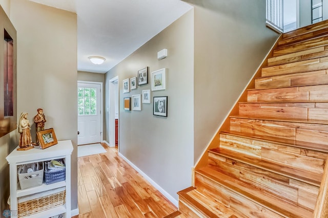 1800 Centre Sq, Moorhead, MN 56560 - doorway to outside featuring stairway and light wood-style flooring