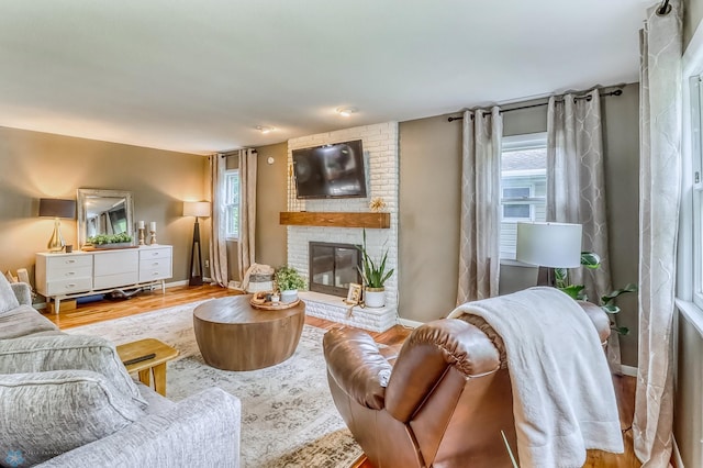 1800 Centre Sq, Moorhead, MN 56560 - living room with a fireplace and wood finished floors