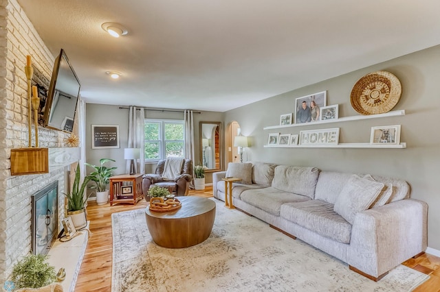 1800 Centre Sq, Moorhead, MN 56560 - living area with a fireplace and light wood-style floors