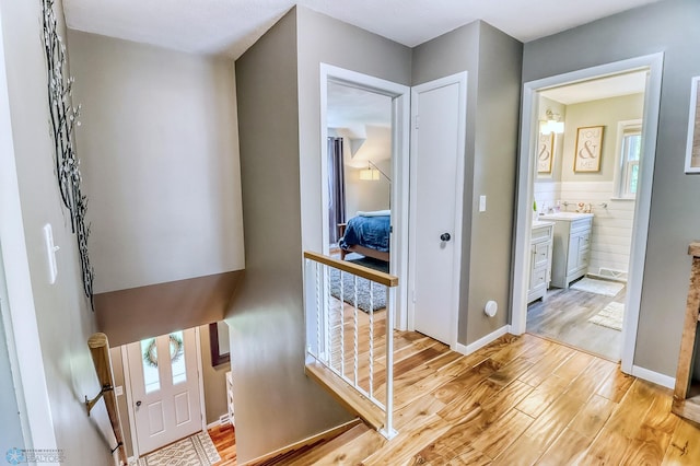 1800 Centre Sq, Moorhead, MN 56560 - hallway featuring light wood-style flooring and a sink