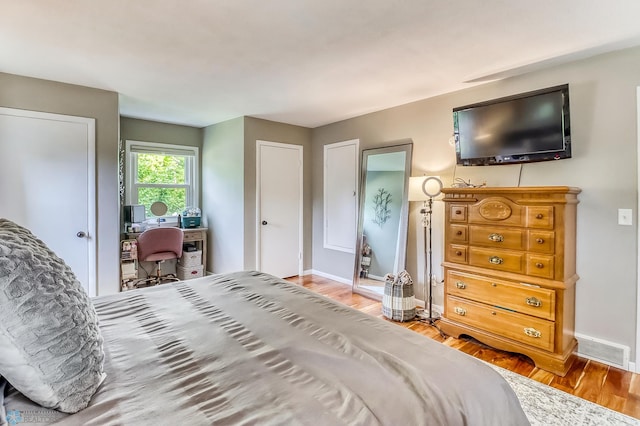 1800 Centre Sq, Moorhead, MN 56560 - bedroom with wood finished floors