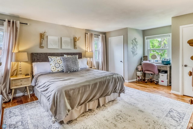 1800 Centre Sq, Moorhead, MN 56560 - bedroom with wood finished floors and baseboards