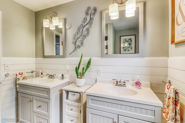1800 Centre Sq, Moorhead, MN 56560 - bathroom featuring two vanities and wainscoting
