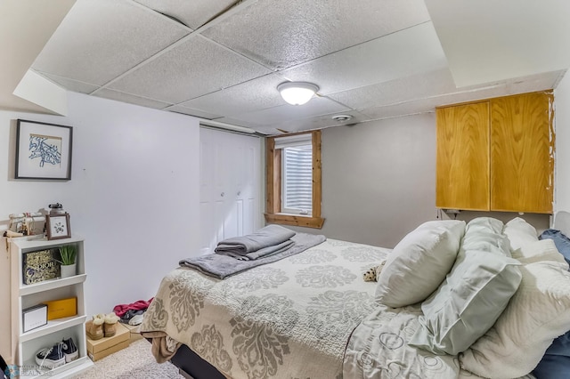 1800 Centre Sq, Moorhead, MN 56560 - carpeted bedroom featuring a paneled ceiling and a closet