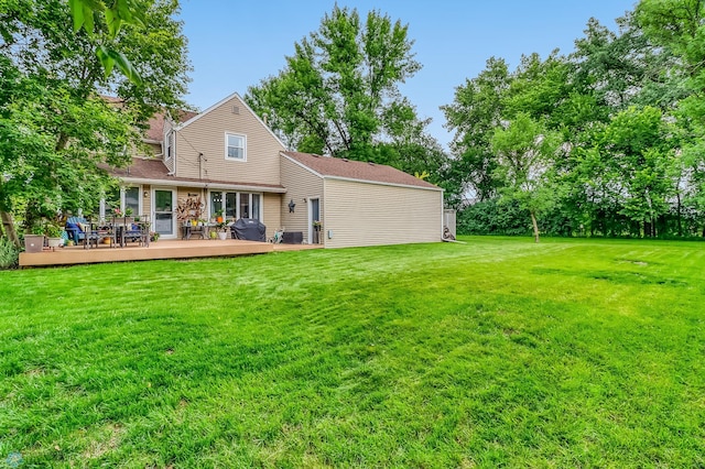 1800 Centre Sq, Moorhead, MN 56560 - rear view of house with a wooden deck and a lawn