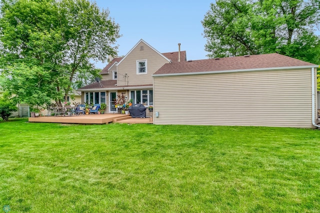 1800 Centre Sq, Moorhead, MN 56560 - rear view of property with a wooden deck, a chimney, and a lawn