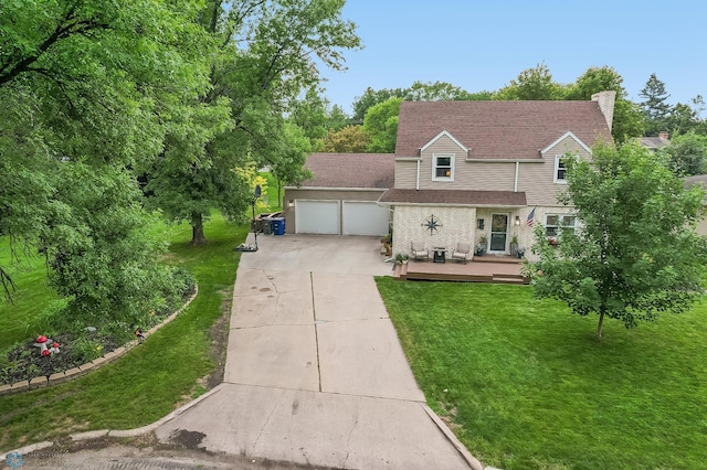 1800 Centre Sq, Moorhead, MN 56560 - view of front of home with driveway, a garage, a front lawn, and a wooden deck