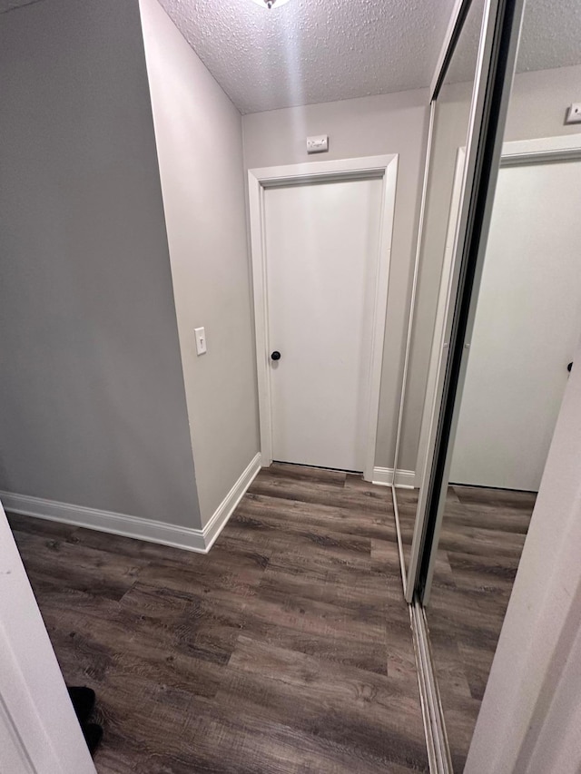 3421 Kent St Unit 607, Shoreview, MN 55126 - corridor featuring a textured ceiling and dark wood finished floors
