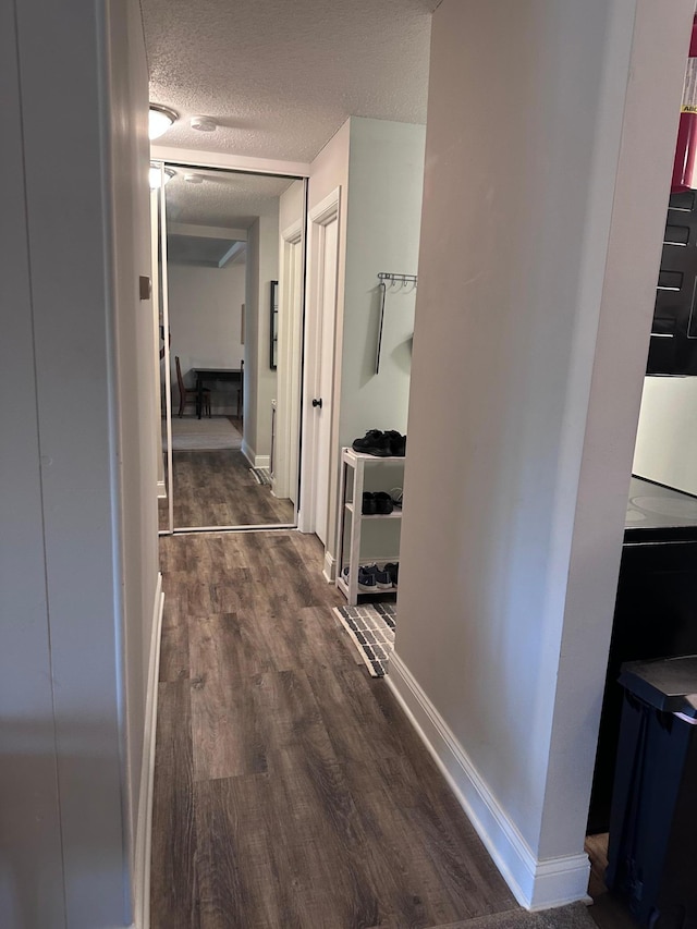 3421 Kent St Unit 607, Shoreview, MN 55126 - corridor featuring dark wood-style flooring and a textured ceiling