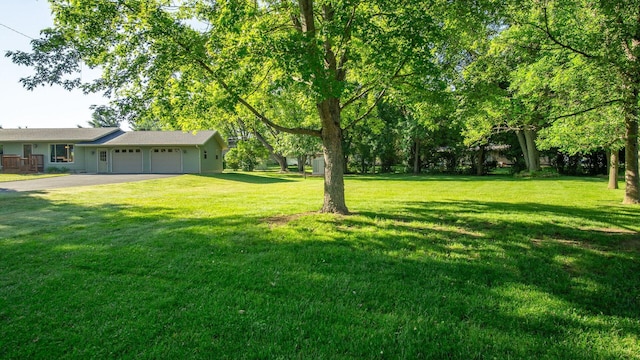 108 Viking Dr, Colfax, WI 54730 - view of green lawn with an attached garage and driveway