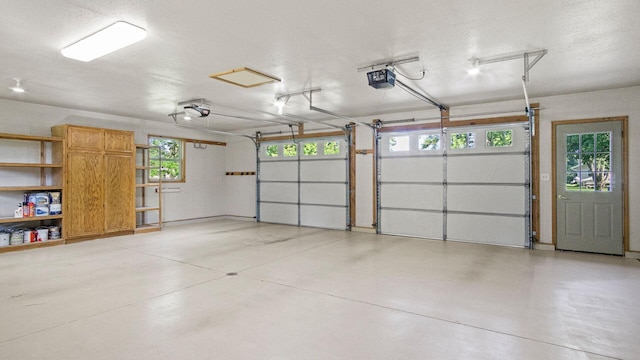 108 Viking Dr, Colfax, WI 54730 - garage featuring a garage door opener