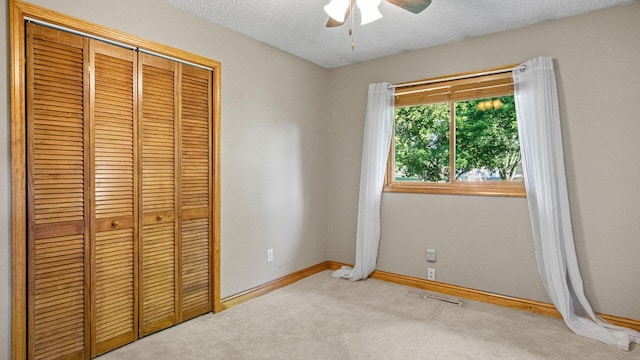 108 Viking Dr, Colfax, WI 54730 - unfurnished bedroom with a closet, carpet flooring, a textured ceiling, and a ceiling fan
