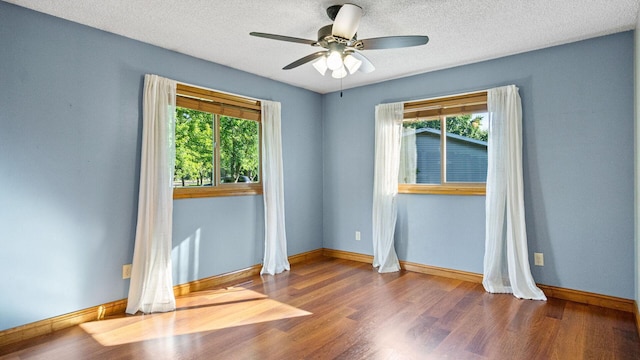 108 Viking Dr, Colfax, WI 54730 - empty room featuring ceiling fan, wood finished floors, and a textured ceiling