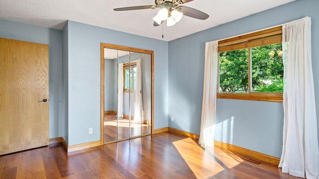 108 Viking Dr, Colfax, WI 54730 - empty room with plenty of natural light, wood finished floors, and a ceiling fan